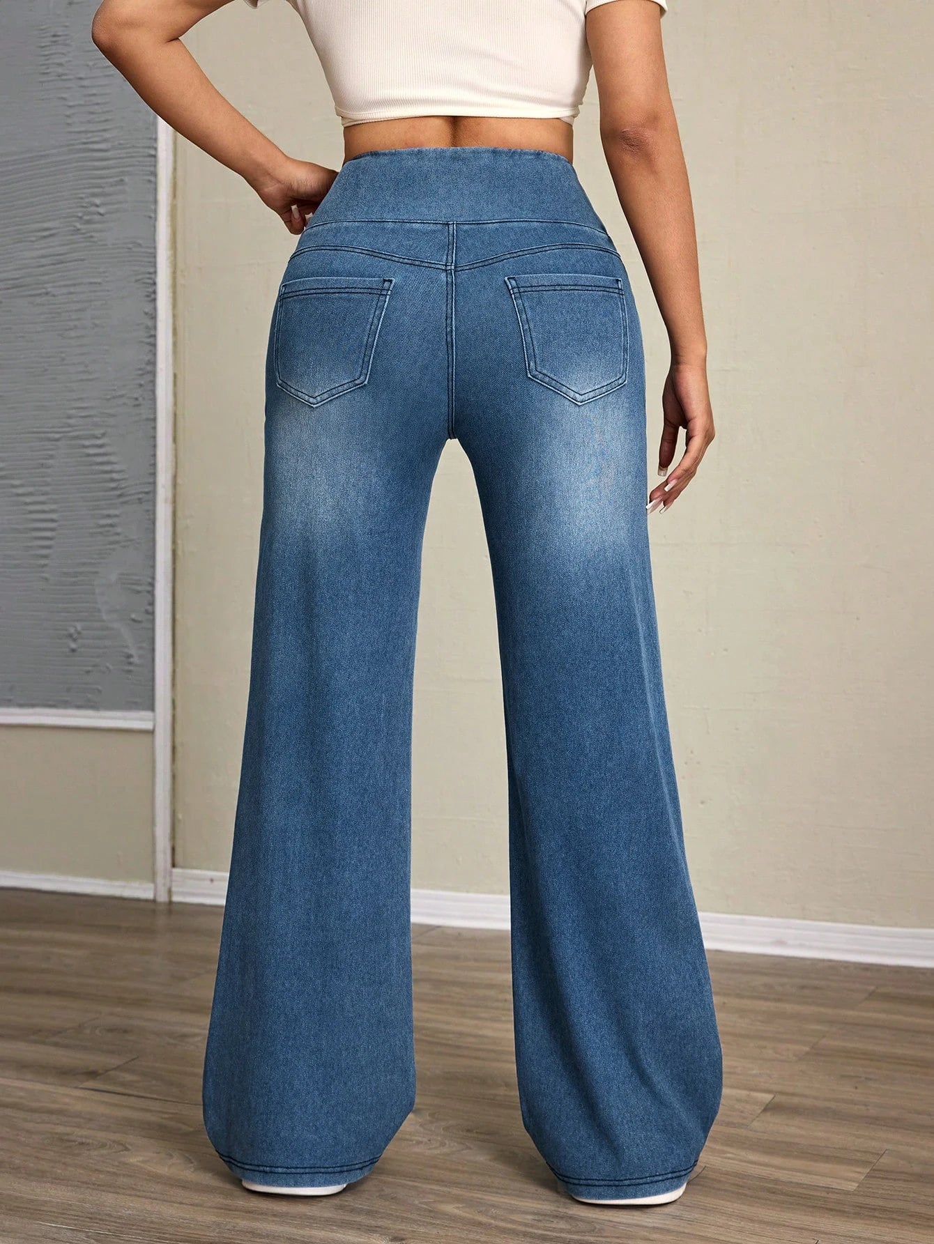 Women's high-rise wide-leg jeans with tummy tuck, slim fit, made from stretch denim fabric, are stylish for casual everyday wear